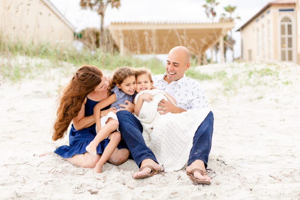 Family at the beach laughing. Family Session style